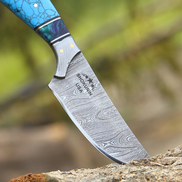Knife with a decorative handle on a natural background
